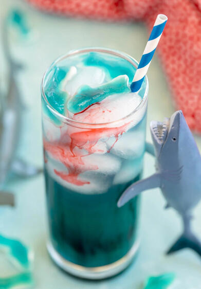 Blood in the Water silver tequila / blue curaçao / lime over ice grenadine droplets added over top